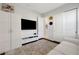 Sitting room with white sofa, built in cabinets, and TV at 1954 Filly Trl, Oviedo, FL 32765