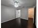 Bedroom with dark hardwood floors and walk-in closet at 1979 Summer Club Dr # 309, Oviedo, FL 32765