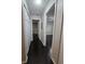 Long hallway with dark hardwood floors at 1979 Summer Club Dr # 309, Oviedo, FL 32765