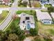 Aerial view of home with pool and solar panels, located in a quiet residential neighborhood at 237 Hazeltine Dr, Debary, FL 32713