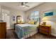 Cozy bedroom with wooden furniture and a ceiling fan at 237 Hazeltine Dr, Debary, FL 32713