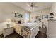 Charming bedroom with white furniture and lovely bedding at 237 Hazeltine Dr, Debary, FL 32713