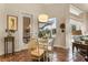 Casual breakfast nook with glass table and chairs, adjacent to the pool at 237 Hazeltine Dr, Debary, FL 32713