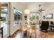 Bright breakfast nook with glass table and chairs, overlooking the pool at 237 Hazeltine Dr, Debary, FL 32713