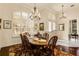 Formal dining room with wood table and chandelier at 237 Hazeltine Dr, Debary, FL 32713