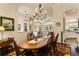 Formal dining room with wood table and chandelier at 237 Hazeltine Dr, Debary, FL 32713