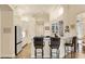 Bright kitchen with white cabinets, marble countertops, and breakfast bar at 237 Hazeltine Dr, Debary, FL 32713