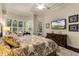 Bright main bedroom with a king-size bed and built-in shelving at 237 Hazeltine Dr, Debary, FL 32713