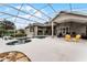 Expansive pool area with covered patio and lounge chairs at 237 Hazeltine Dr, Debary, FL 32713