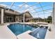 Inviting pool and spa with screened enclosure and spacious deck at 237 Hazeltine Dr, Debary, FL 32713