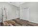 Bedroom featuring a closet and laminate wood flooring at 2555 Sand Arbor Cir, Orlando, FL 32824