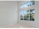 Bright, airy living room featuring tile floors and a large window allowing natural light to fill the room at 2555 Sand Arbor Cir, Orlando, FL 32824