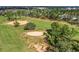 Aerial view of a lush green golf course at 257 Bonville Dr, Davenport, FL 33897