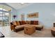 Bright living room with comfy sectional sofa and access to a patio at 257 Bonville Dr, Davenport, FL 33897