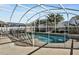 Inviting screened pool with safety fence at 257 Bonville Dr, Davenport, FL 33897