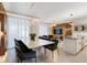 Modern dining room with large table, black chairs, and an impressive wooden wall feature at 2600 Reading Trl, Kissimmee, FL 34746