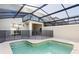 Relaxing screened pool and spa, ideal for outdoor enjoyment at 2600 Reading Trl, Kissimmee, FL 34746