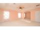 Bright bedroom with carpeted floors and soft peach walls at 2642 Maggiore Cir, Kissimmee, FL 34746