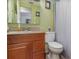 Clean bathroom with wood vanity and updated fixtures at 3107 S Park Ave, Sanford, FL 32773