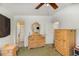 Bedroom with a dresser, full-length mirror, and ensuite bathroom at 3107 S Park Ave, Sanford, FL 32773