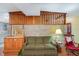 Living room with wood floors, brick wall, and built-in shelving at 3107 S Park Ave, Sanford, FL 32773