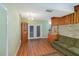 Living room with wood floors, brick accent wall, and built-ins at 3107 S Park Ave, Sanford, FL 32773