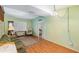 Living room with wood floors and view into bedroom at 3107 S Park Ave, Sanford, FL 32773