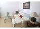 Living room featuring a white leather sectional sofa and glass-top coffee table at 3333 Wauseon Dr, Saint Cloud, FL 34772