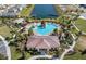 Aerial view showcasing the community pool with water park, clubhouse and scenic pond at 3333 Wauseon Dr, St Cloud, FL 34772