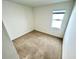 Neutral bedroom with carpet, a large window and fresh white walls at 3333 Wauseon Dr, St Cloud, FL 34772