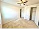 Neutral bedroom featuring a ceiling fan and two closets at 3333 Wauseon Dr, St Cloud, FL 34772