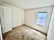 This bedroom has neutral carpet, one window, and white walls at 3333 Wauseon Dr, St Cloud, FL 34772