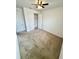 Neutral bedroom featuring a ceiling fan and two closets at 3333 Wauseon Dr, St Cloud, FL 34772