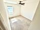 Neutral bedroom with carpet, fresh white walls, a window and a ceiling fan at 3333 Wauseon Dr, St Cloud, FL 34772