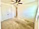 Bedroom with ceiling fan and large closet at 3333 Wauseon Dr, St Cloud, FL 34772