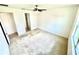 This bedroom has neutral walls, carpet, a ceiling fan and a window at 3333 Wauseon Dr, St Cloud, FL 34772