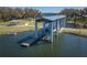 Elevated view of boat lift and lift platform in community lake at 3333 Wauseon Dr, St Cloud, FL 34772