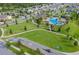 Aerial view of community with pool, playground, and green space at 3333 Wauseon Dr, St Cloud, FL 34772