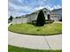 Charming home with well-manicured lawn and inviting curb appeal on a sunny day at 3333 Wauseon Dr, St Cloud, FL 34772