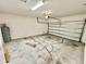 View of the two car garage showing the door, water heater and concrete floor at 3333 Wauseon Dr, St Cloud, FL 34772