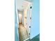Hallway featuring neutral tile flooring with white trim and doorways at 3333 Wauseon Dr, St Cloud, FL 34772