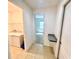 Hallway leading to laundry room and bedroom with granite countertop at 3333 Wauseon Dr, St Cloud, FL 34772