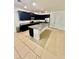 Modern kitchen with dark cabinets, granite countertops, stainless steel appliances, and central island at 3333 Wauseon Dr, St Cloud, FL 34772