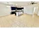 Open kitchen features dark cabinetry, an island, and modern appliances, offering both style and functionality at 3333 Wauseon Dr, St Cloud, FL 34772