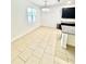 Open kitchen and dining area features an island with granite countertops, dark cabinets and tile flooring at 3333 Wauseon Dr, St Cloud, FL 34772