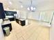 Spacious kitchen featuring dark cabinetry, stainless steel appliances and a central island for cooking at 3333 Wauseon Dr, St Cloud, FL 34772