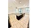 Bright, open kitchen showcases tile flooring, a central island, and modern stainless steel appliances at 3333 Wauseon Dr, St Cloud, FL 34772