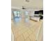 Open concept floor plan featuring a kitchen, dining, and living area with access to a screened in porch at 3333 Wauseon Dr, St Cloud, FL 34772