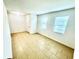 Bright living room with tile flooring, fresh white walls, and natural light from the windows at 3333 Wauseon Dr, St Cloud, FL 34772