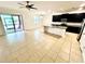 Open concept floor plan featuring a kitchen, dining, and living area with access to a screened in porch at 3333 Wauseon Dr, St Cloud, FL 34772